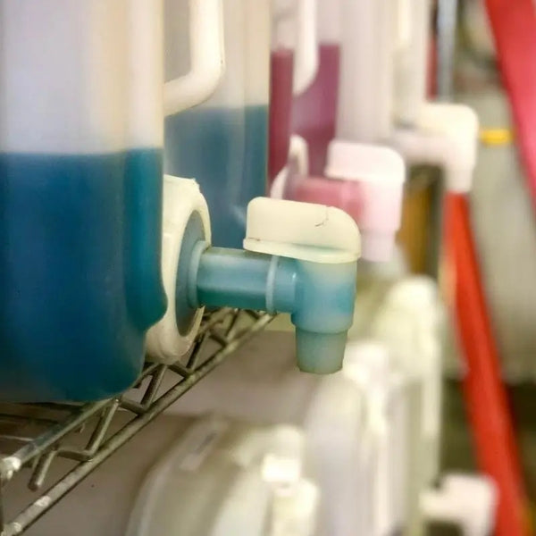 Spigots on jugs in our highly active wash bay at Image Wash Products.