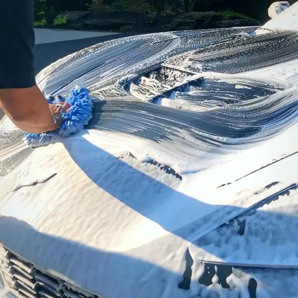 Person washing car using Car Wash and Wax - Detailer Grade Soap from Image Wash Products