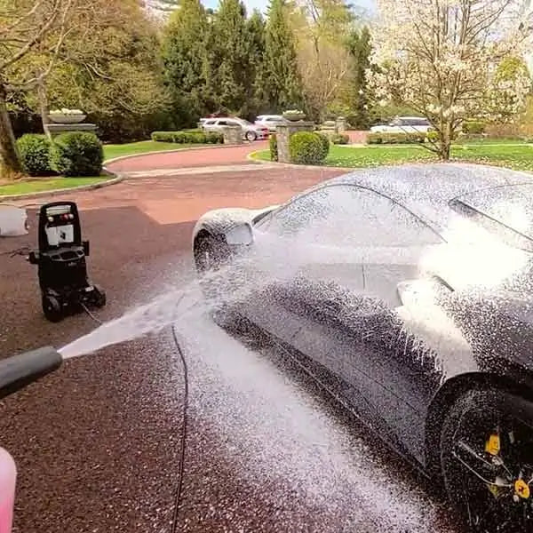 Person spraying car with Car Wash and Wax - Detailer Grade Soap from Image Wash Products