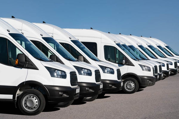 Delivery fleet of vans freshly washed, shining in the sun