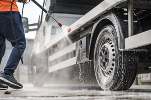 Washing semi truck with soap for pressure washer foam cannons.