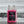 Pink bottle of Image Wash Products Ceramic Wax Replacement with a car wash background