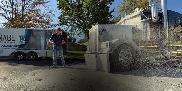 Image Wash Products being foamed onto a semi truck with a custom foaming lance and downstream chemical injector. 55 gallon drums of heavy-duty touchless wash soap.