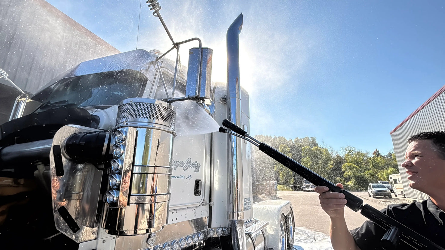 Pressure washing a large semi truck with polished aluminum. 