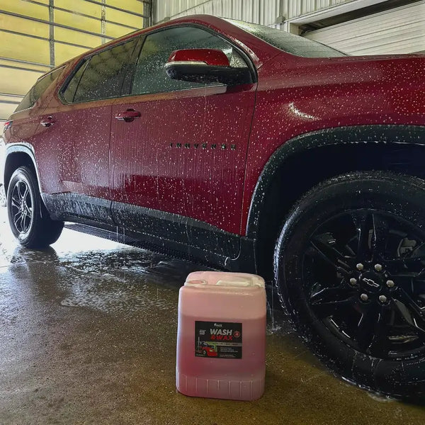 5 Gallon of Image Wash & Wax in front of sudsy red Traverse. 
