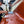 Man holding spray bottle of Quick Detailer spraying and wiping on semi truck fender