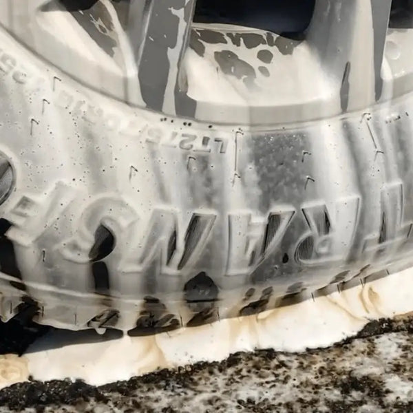 degreaser foam pulling dirt and grime off of tire