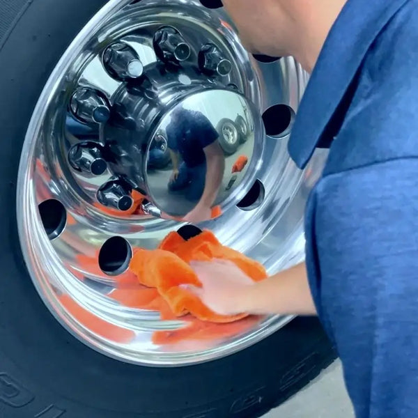 Quick detailer being applied to polished rims